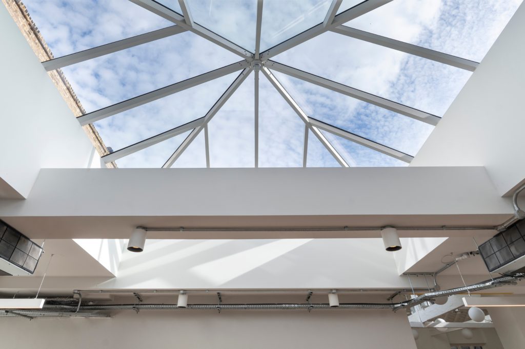 Internal view of bespoke pyramid lantern rooflight installed in London commercial refurbishment.