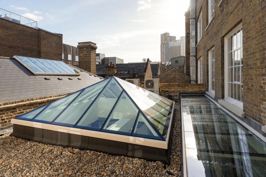 Bespoke rooflights in London including ridge rooflights, pyramid lantern rooflight and abutted box rooflight on flat roof