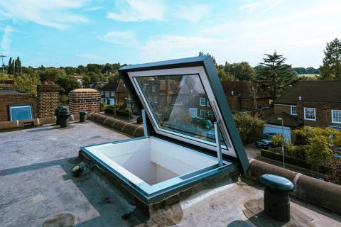 Eletrical access hatch rooflight fully open