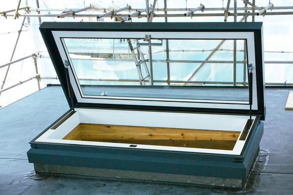 Manual access hatch rooflight being installed