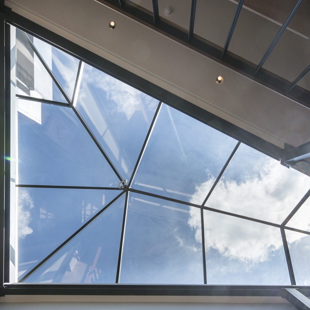 Custom-designed multipart glass rooflight installed on a flat roof, enhancing daylight and modern aesthetics