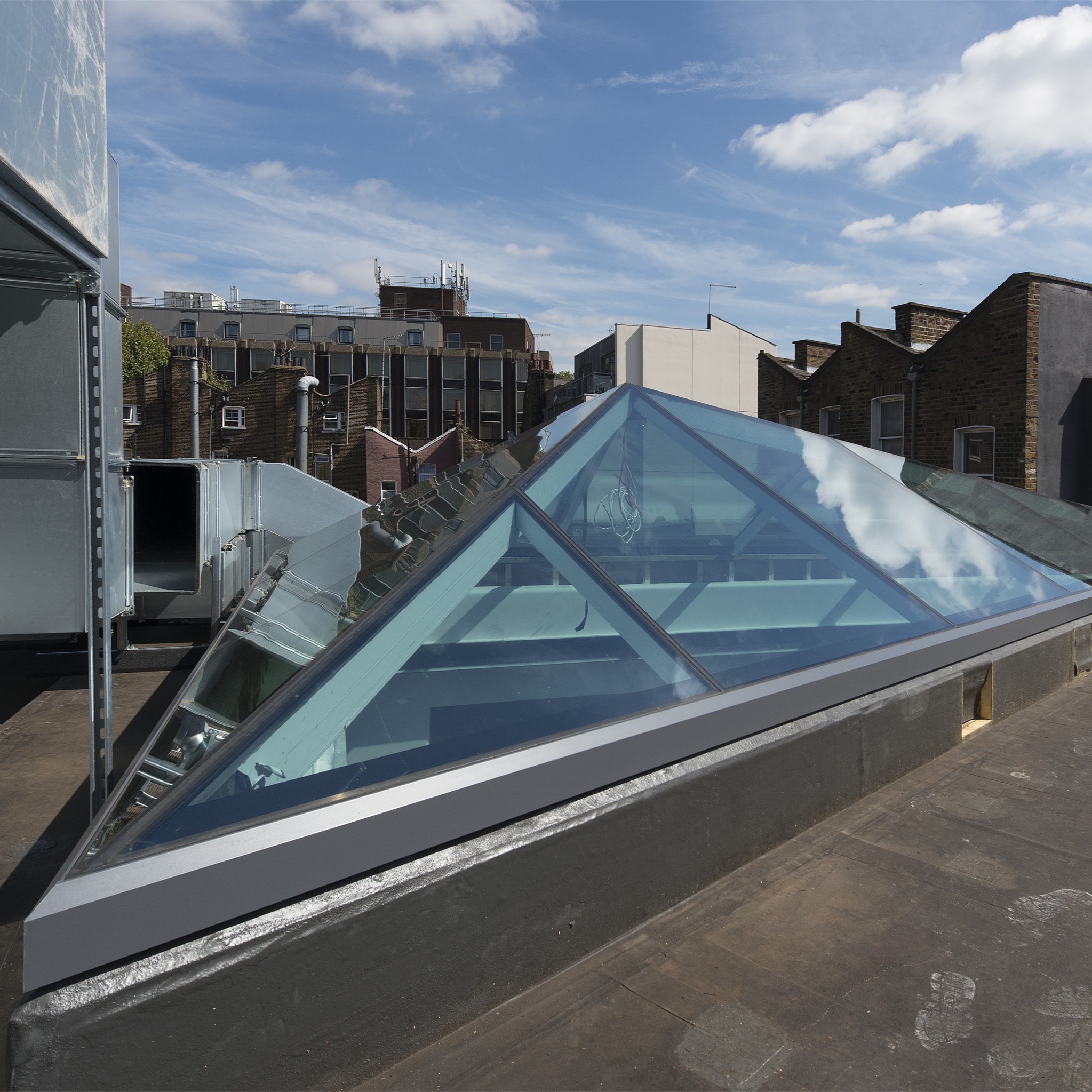 This multi part glass skylight was used for a commercial project and let natural light flood into the space below.