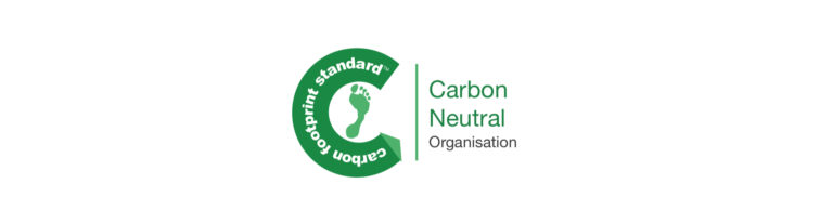Logo of a Carbon Neutral Organisation, featuring a green circular design with text "Carbon footprint standard" and a footprint symbol.