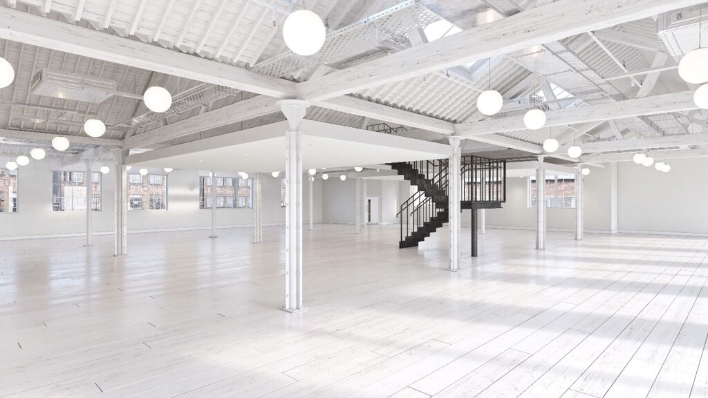 Spacious, empty industrial loft with bespoke glass boxes, white painted floors, ceiling, and columns, large windows, spherical hanging lights, and a central black metal staircase.